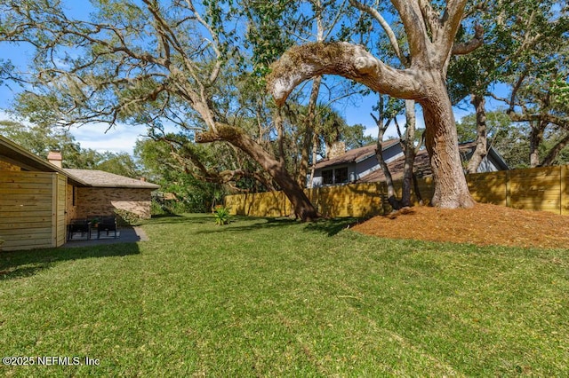 view of yard with fence