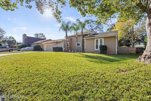 ranch-style home with a garage, a front yard, fence, and stucco siding