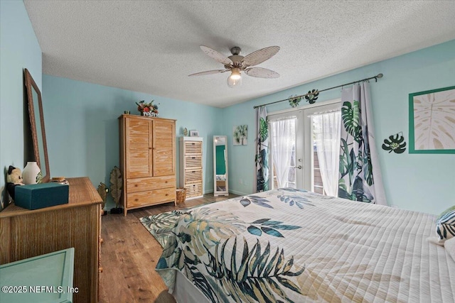 bedroom with a textured ceiling, ceiling fan, wood finished floors, access to exterior, and french doors