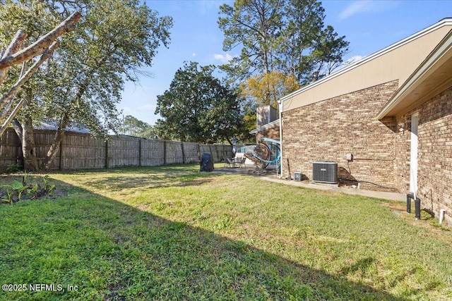 view of yard with cooling unit and a fenced backyard