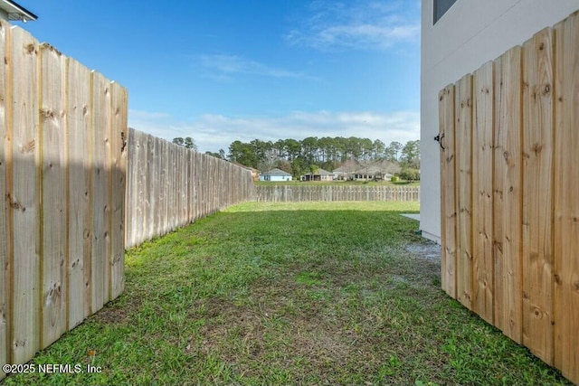 view of yard featuring a fenced backyard