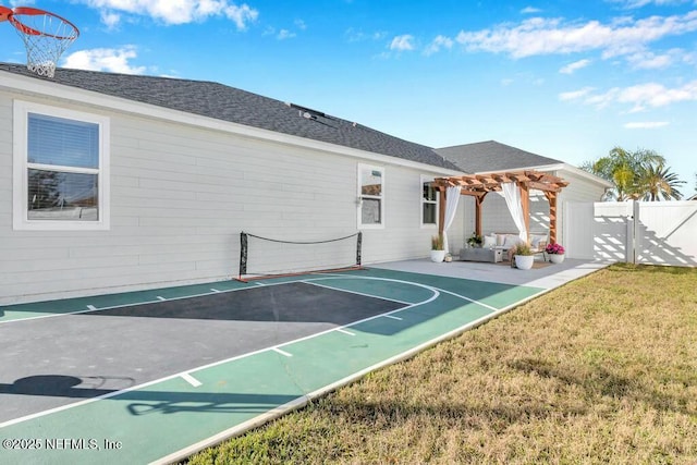 view of sport court featuring a yard, basketball hoop, a gate, fence, and a pergola