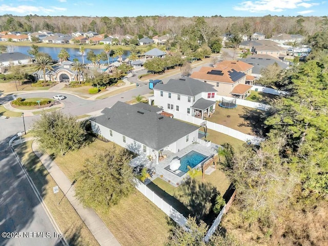 bird's eye view featuring a water view and a residential view