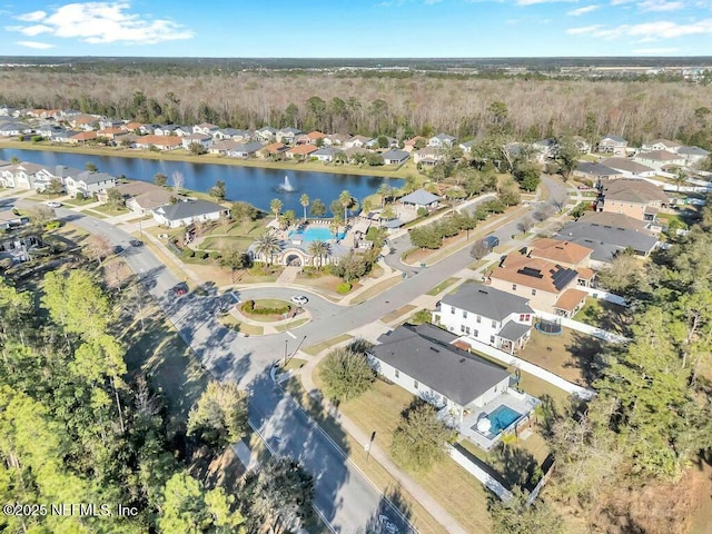 birds eye view of property featuring a water view and a residential view