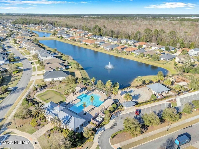 birds eye view of property featuring a water view and a residential view