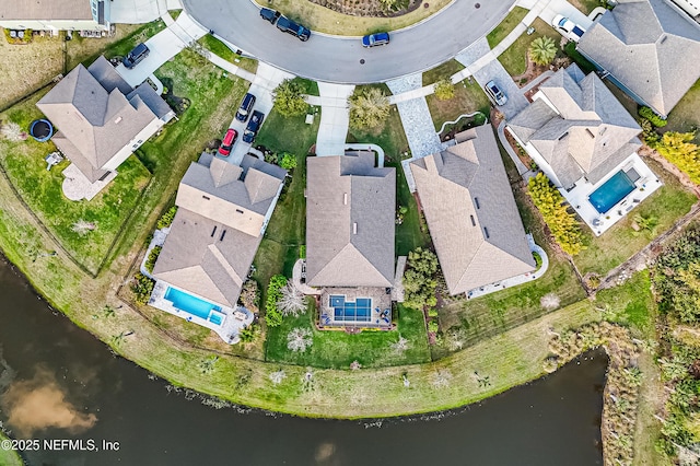 bird's eye view with a water view