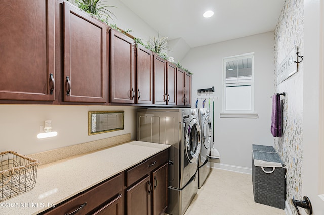 washroom with washing machine and dryer, cabinet space, baseboards, and recessed lighting