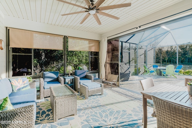 sunroom with plenty of natural light and ceiling fan