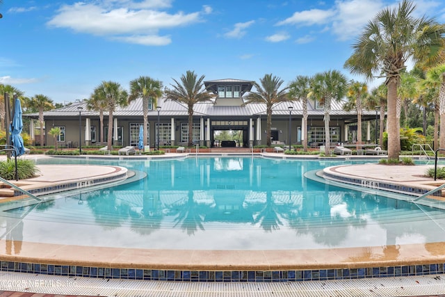 community pool featuring a patio area