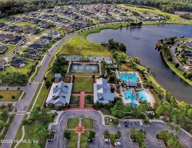 bird's eye view with a residential view and a water view