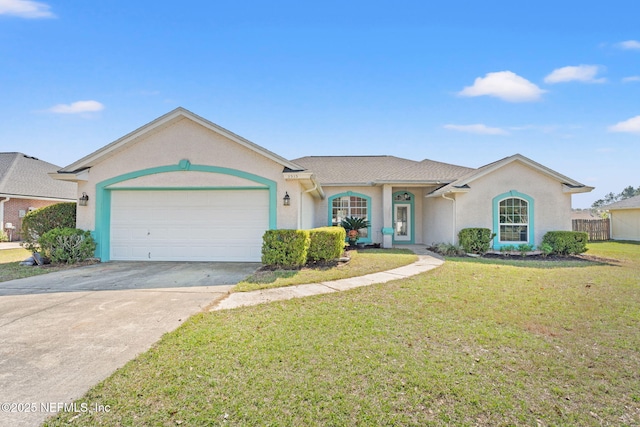 single story home with a garage, driveway, a front yard, and stucco siding