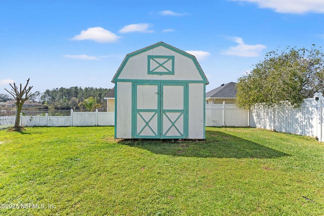 view of shed featuring a fenced backyard