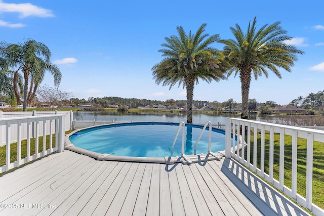 view of swimming pool featuring a deck with water view