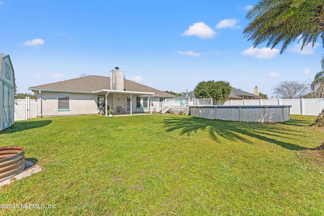 view of yard featuring a fenced backyard and a fenced in pool