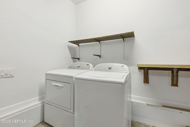 clothes washing area featuring laundry area and washer and dryer