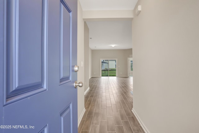 interior space featuring dark wood finished floors and baseboards