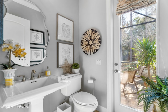 bathroom featuring toilet and a sink