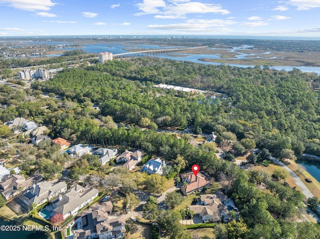 drone / aerial view featuring a residential view and a water view