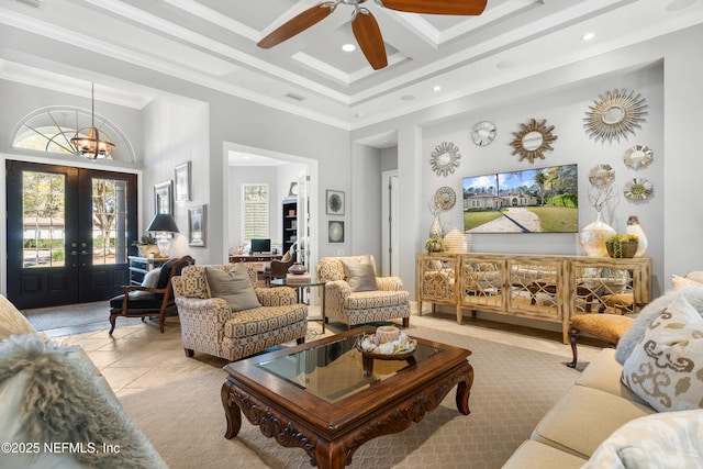 living area featuring crown molding, visible vents, a high ceiling, light tile patterned flooring, and coffered ceiling