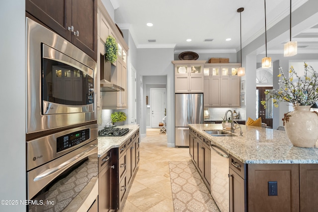 kitchen with tasteful backsplash, hanging light fixtures, appliances with stainless steel finishes, glass insert cabinets, and a sink