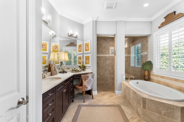 full bathroom featuring baseboards, ornamental molding, a garden tub, vanity, and a walk in shower