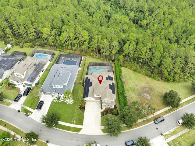 aerial view with a wooded view