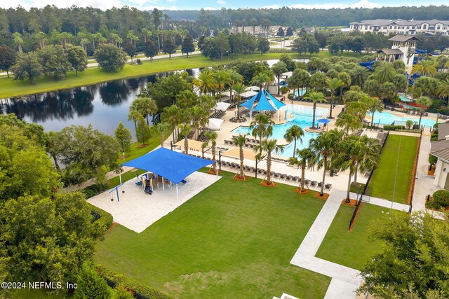 birds eye view of property with a water view