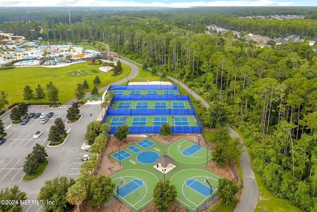 birds eye view of property featuring a wooded view