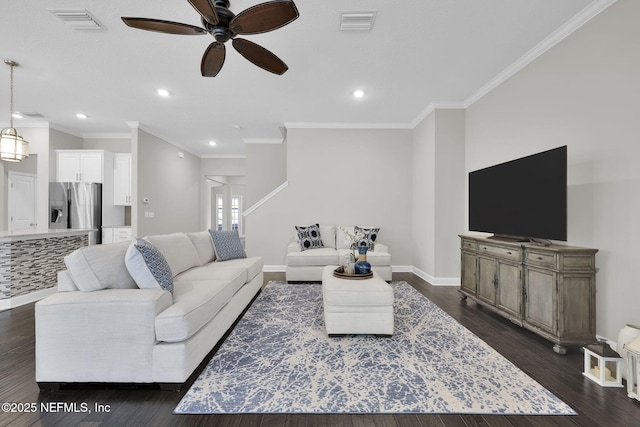 living room with dark wood-style floors, baseboards, and visible vents