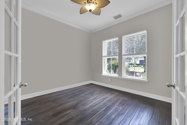 unfurnished room with dark wood-style floors, french doors, crown molding, and baseboards