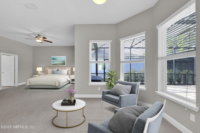 carpeted bedroom featuring visible vents and baseboards