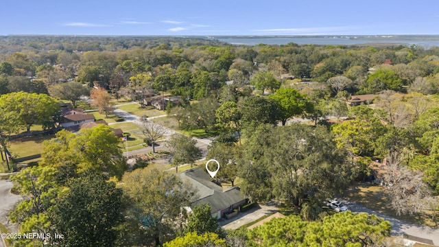 birds eye view of property featuring a wooded view