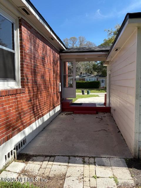 view of property exterior featuring brick siding