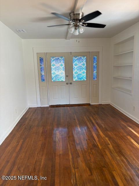 entrance foyer featuring hardwood / wood-style floors, a ceiling fan, visible vents, and baseboards