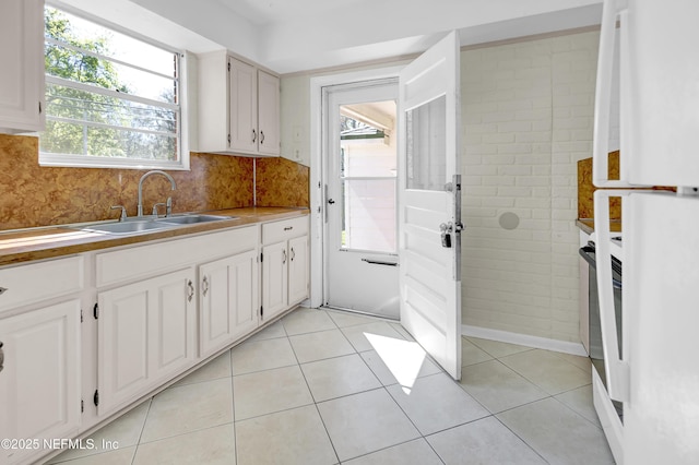 4804 Elizabeth Ter, Jacksonville, FL 32205 - kitchen featuring white cabinetry, a sink, and light tile patterned floors