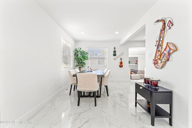 dining area featuring marble finish floor, baseboards, and recessed lighting