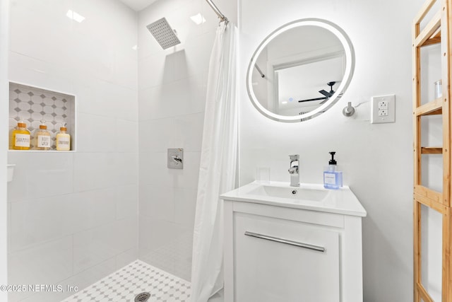 bathroom featuring a stall shower and vanity