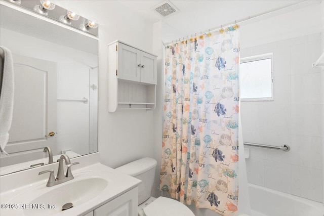 bathroom with shower / bath combination with curtain, visible vents, vanity, and toilet