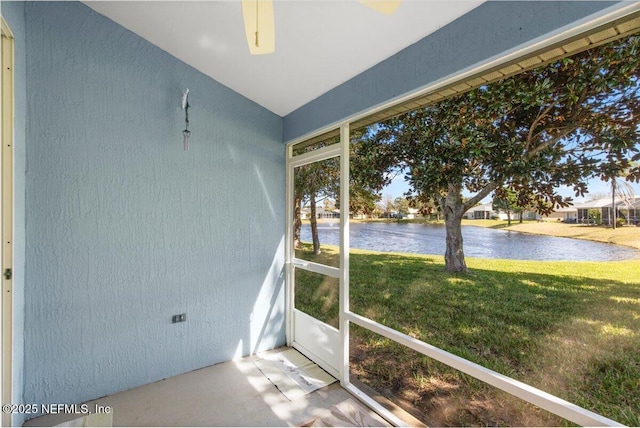 unfurnished sunroom featuring a water view and lofted ceiling