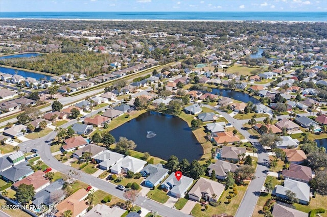 aerial view with a water view and a residential view