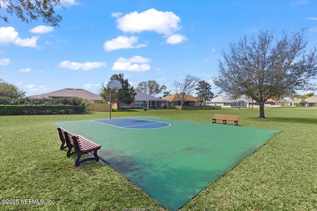 view of sport court featuring community basketball court, a yard, and fence