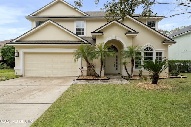 view of front of home with a garage, a front yard, concrete driveway, and stucco siding