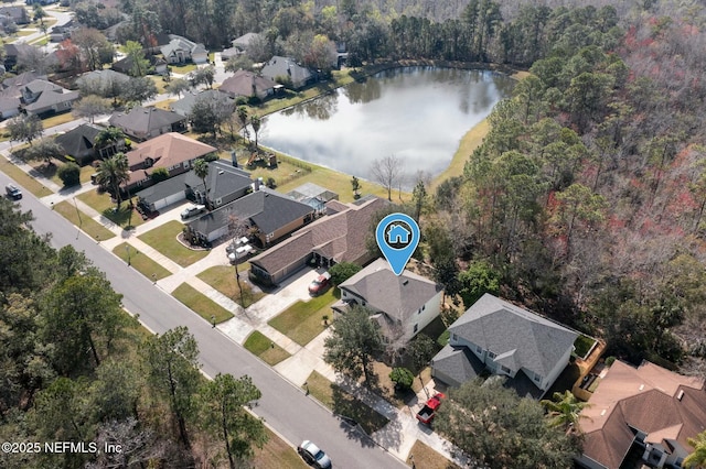 bird's eye view with a water view and a residential view