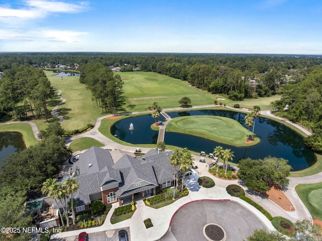 birds eye view of property with a water view, golf course view, and a wooded view