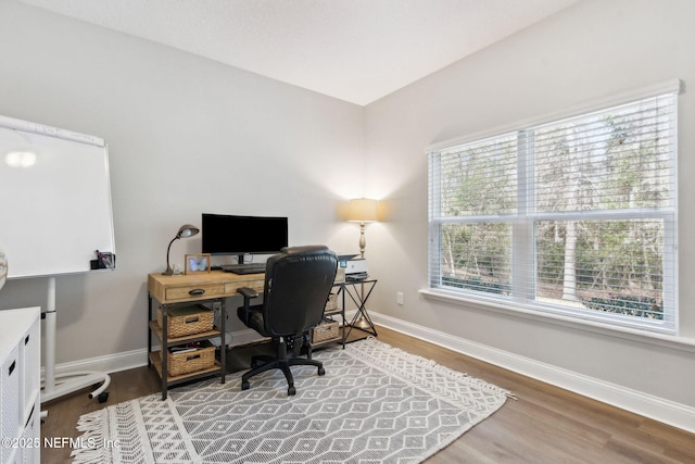 office area featuring baseboards and wood finished floors