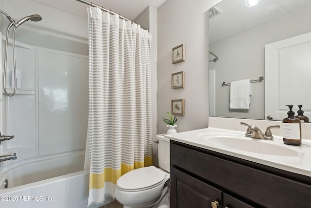 bathroom with visible vents, toilet, vanity, and shower / tub combo