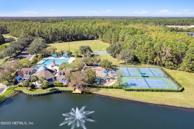 bird's eye view with a water view and a wooded view