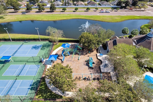 drone / aerial view with a water view and a residential view