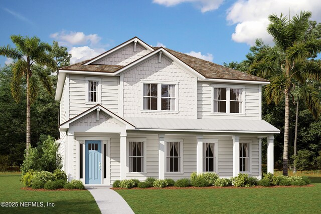 view of front of house featuring metal roof and a front lawn