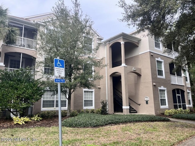 view of property featuring stairway